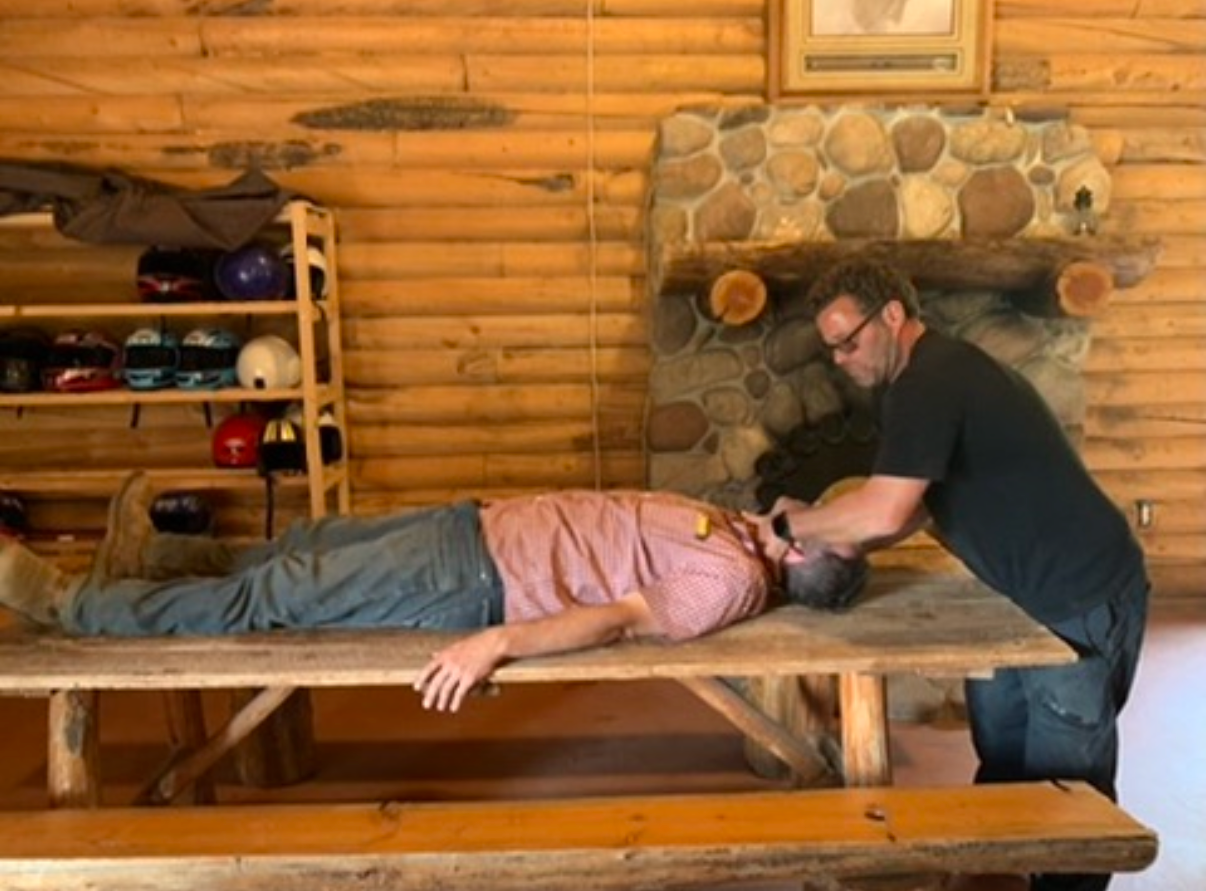 Dr. Goldstein performing an in-home spinal adjustment